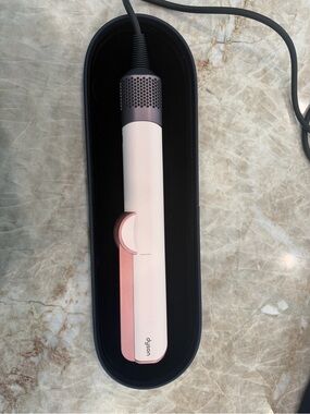Dyson hair styler in blush pink with rose-gold accents